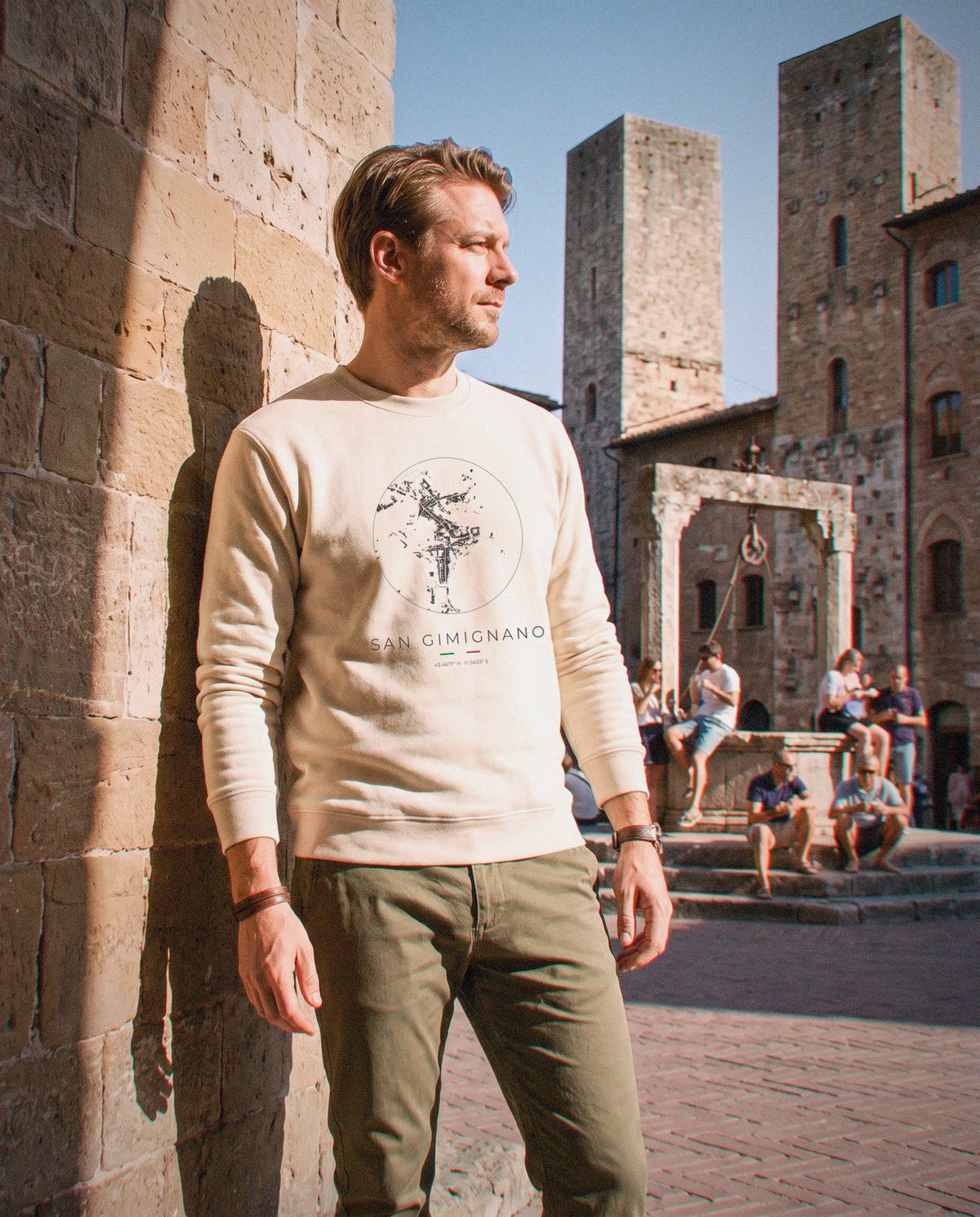 San Gimignano map sweatshirt in Sand, circle street map of San Gimignano, worn in San Gimignano. Postmark.